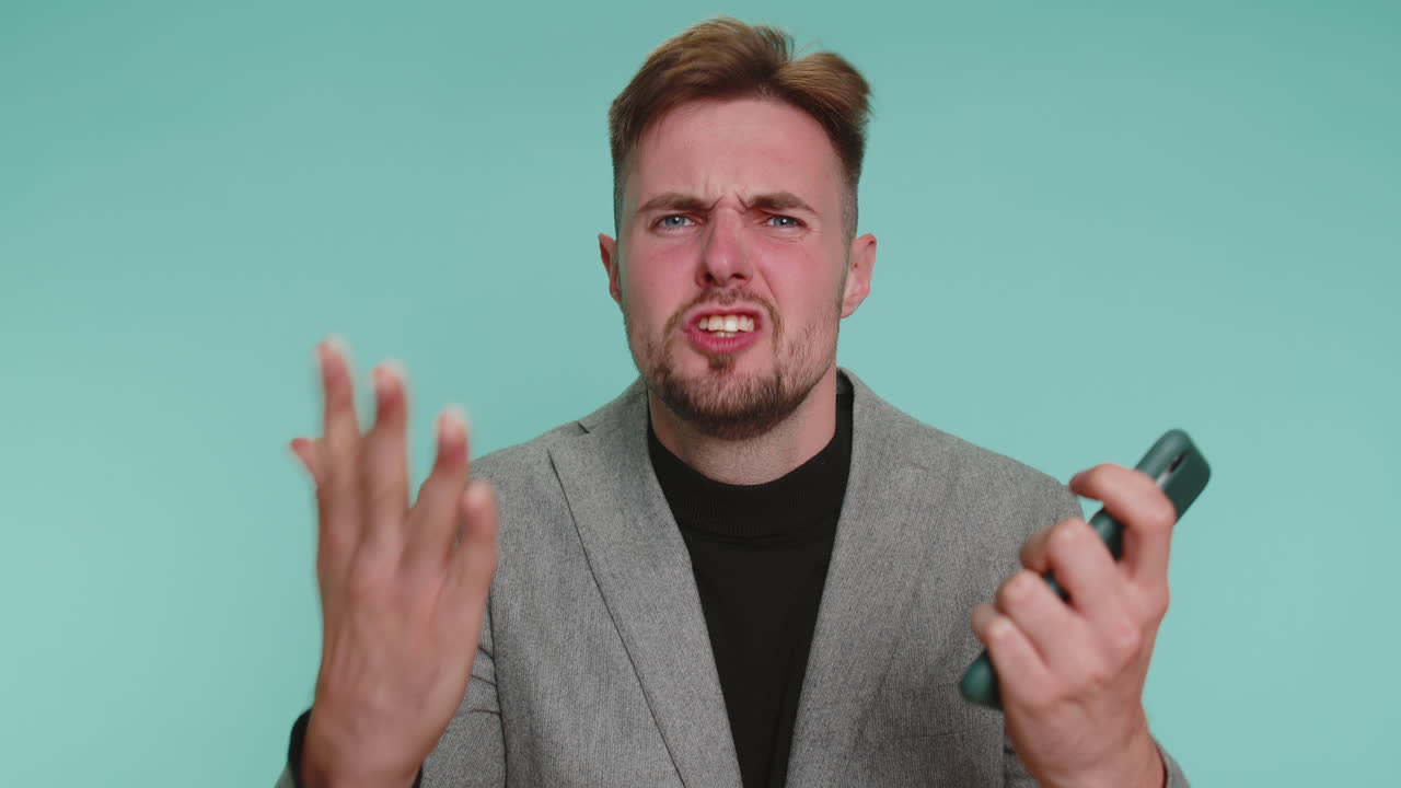 Business man use smartphone typing browsing loses becoming surprised lottery results bad fortune