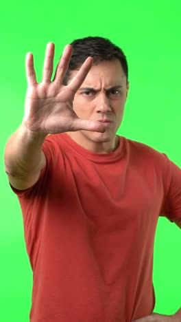 Man Showing Stop Gesture on Green Screen