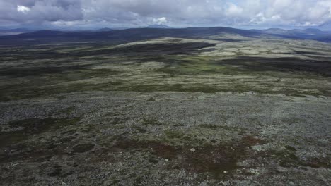 aerial descends to barren rocky, hilly landscape in spekdalen norway