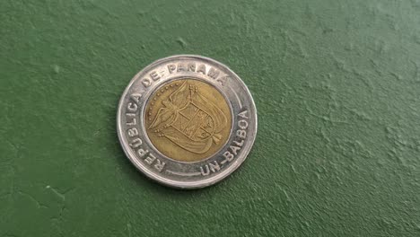 one balboa coin, national currency of panama, using us dollars banknotes for payments