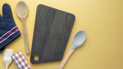 kitchen utensils and supplies on a yellow background