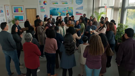 diverse group of professionals applauding in an office meeting