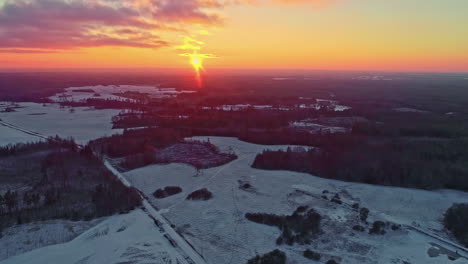 golden sunset sky illuminated in snowscape landscape