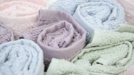 rolled pastel-colored towels