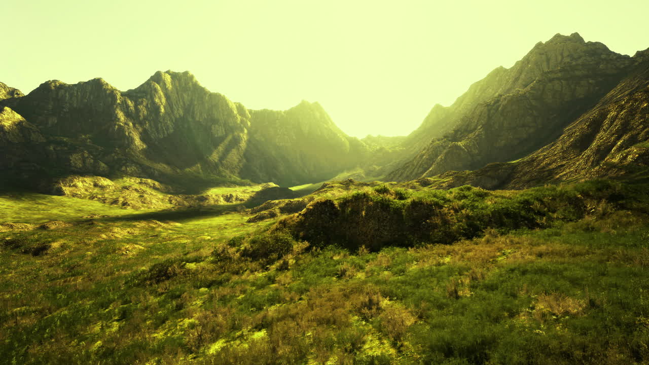 Sunset light casts golden hues over mountain valley landscape in nature