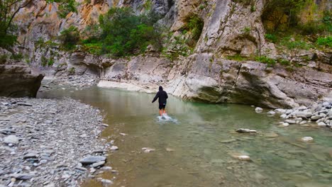 a man walking in lengarica canyon