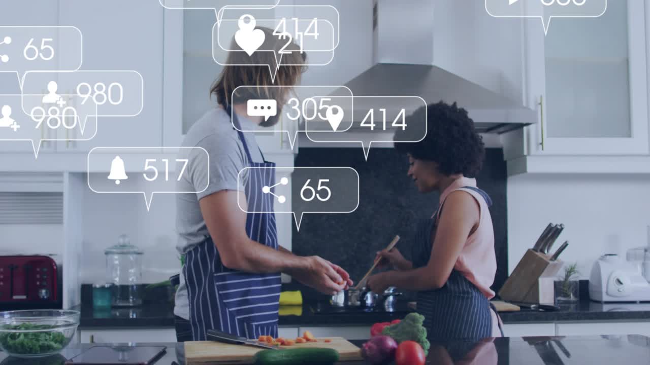 Cooking couple chopping carrots and stirring pot on island with animated icons rising then ebbing