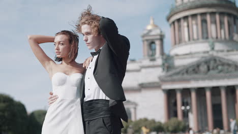 couple posing in front of a church