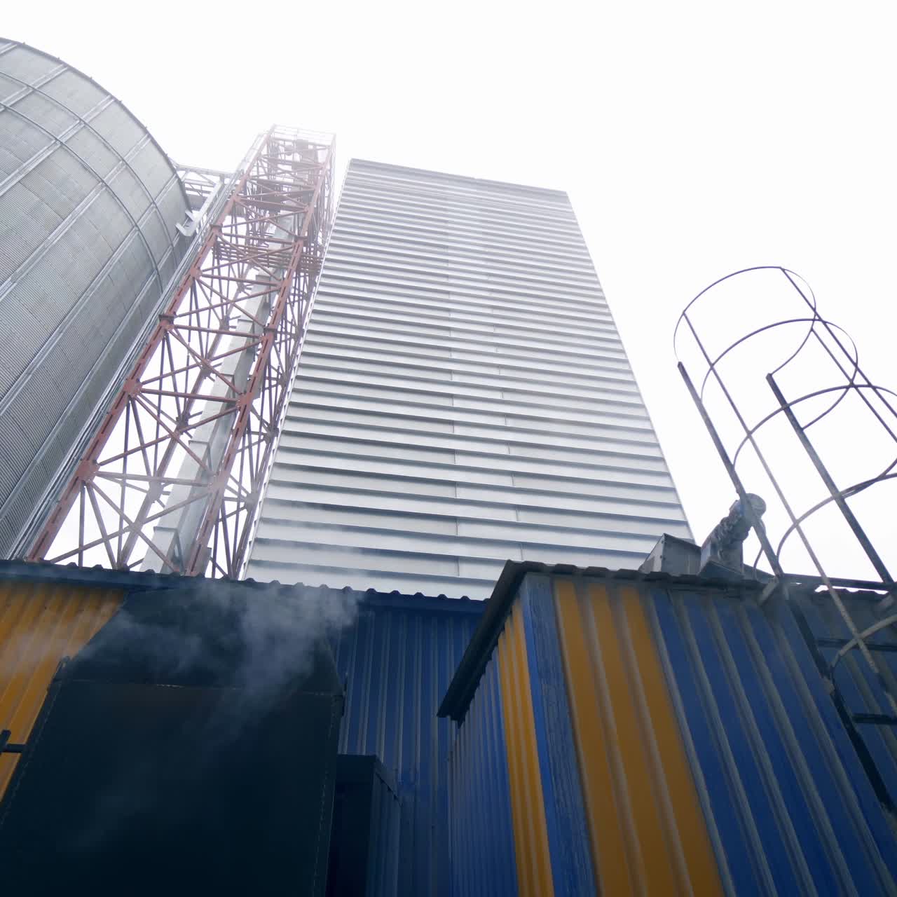 Storage granary technology tank. Big factory elevator construction