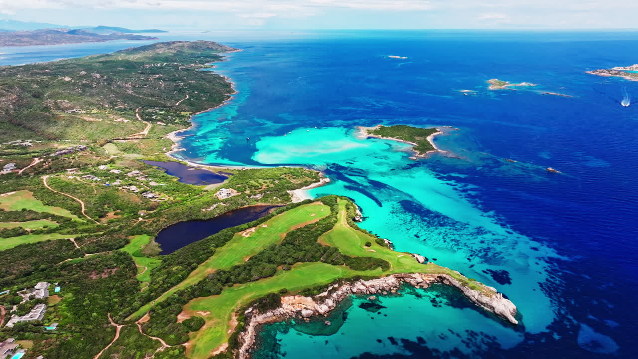 Aerial drone view of beautiful coastline of Corsica, France. High view of the colorful turquoise sea and the picturesque green landscape. Bird's eye view of the beaches. Summer holidays destination