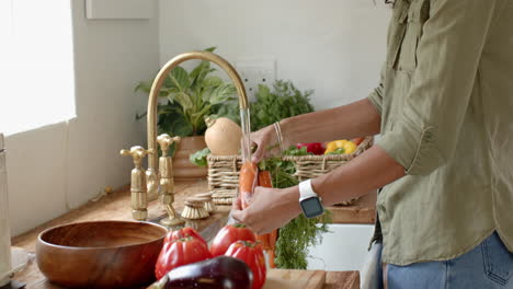 washing fresh vegetables in kitchen, preparing healthy meal with focus on produce, at home