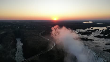 aerial view of victoria falls at sunset, zimbabwe