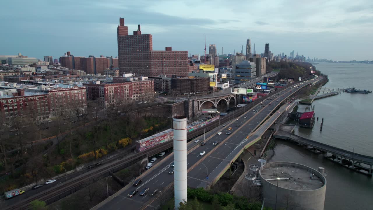 Industrial looking clip of NYC's Hudson Highway, traffic to and from downtown Manhattan in early evening