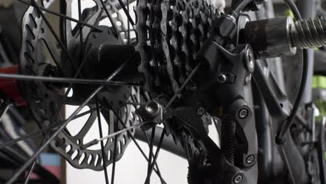 low angle view of slow spinning rear bike cassette on hub with disc brake