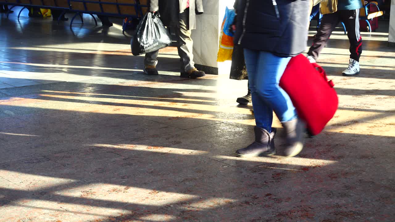 Passengers at the Kiev railway station. Ukraine, shooting in the spring