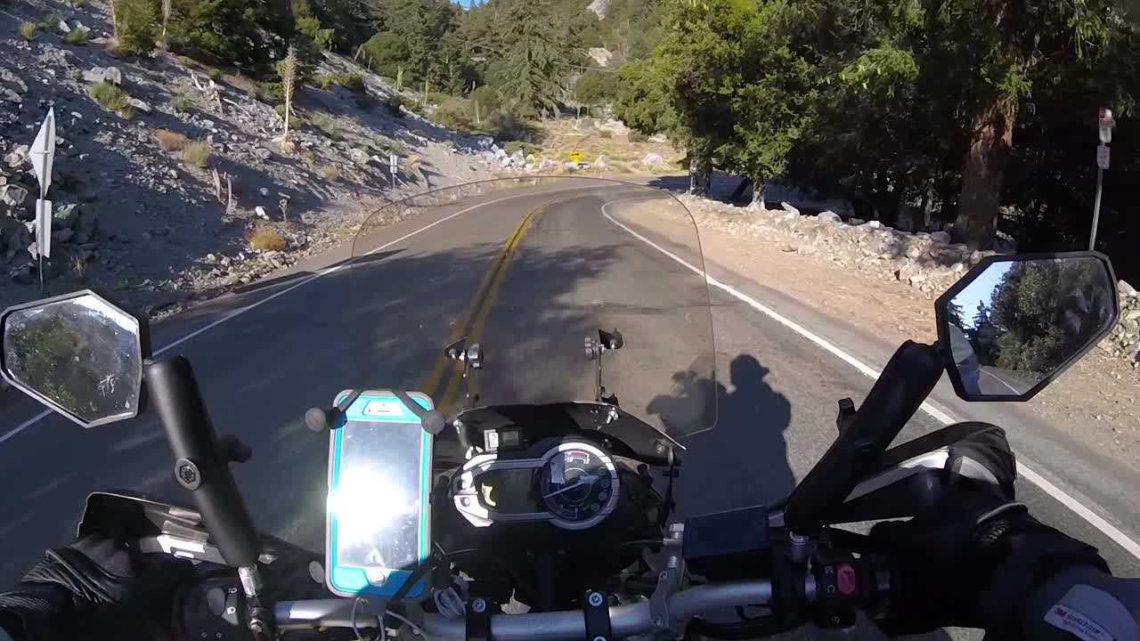 POV biker riding motorcycle on road on slope of MT, Baldy, California USA