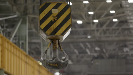 industrial crane hook in factory setting