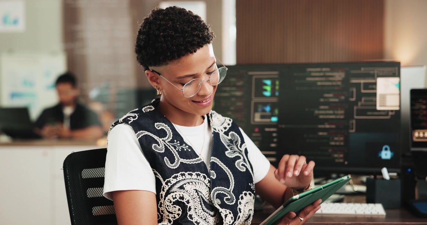 Professional Woman Using Tablet in Modern Tech Office