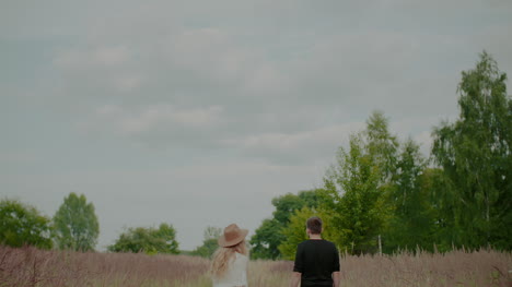 Attractive-Girl-Embracing-Her-Lover-And-Smile-Outdoors-In-Summer