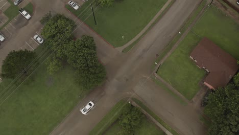 Two-cars-creep-through-a-flash-flooded-street