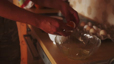 Close-up-of-a-person-separating-the-white-from-the-yolk-when-breaking-an-egg