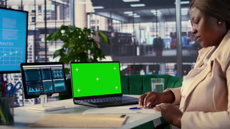 business woman working on laptop in modern office