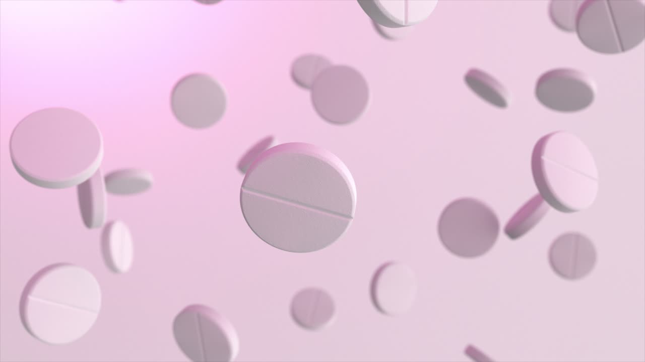 ピンクの背景に浮かぶ錠剤