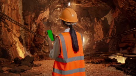 engineer reviewing data in a tunnel