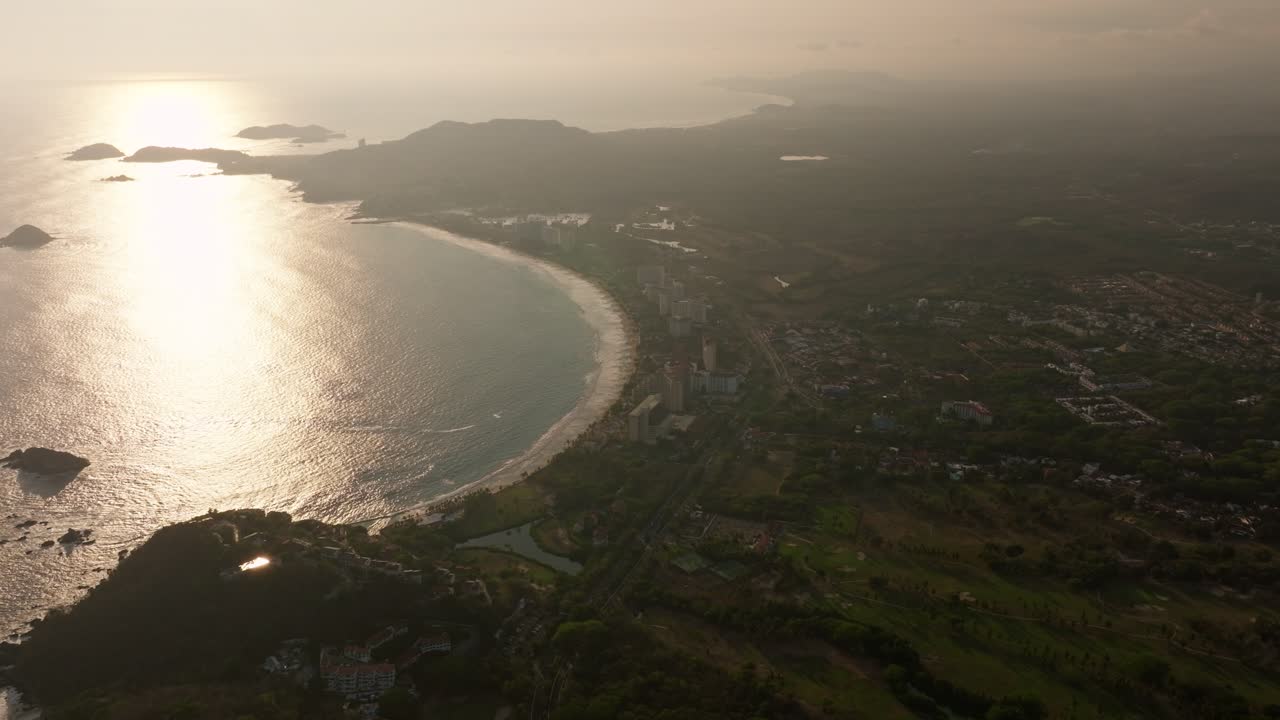 DRONE: HIGH ALTITUDE SHOT OF IXTAPA BEACH AT SUNSET