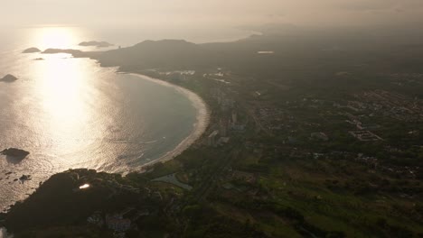 drone: high altitude shot of ixtapa beach at sunset