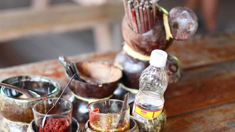 coconut shell condiments at a market stall