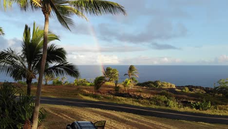 rainbow at sunset over the pacific ocean and cliffs