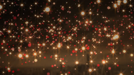 animation of yellow and red christmas flickering spots over cityscape in background