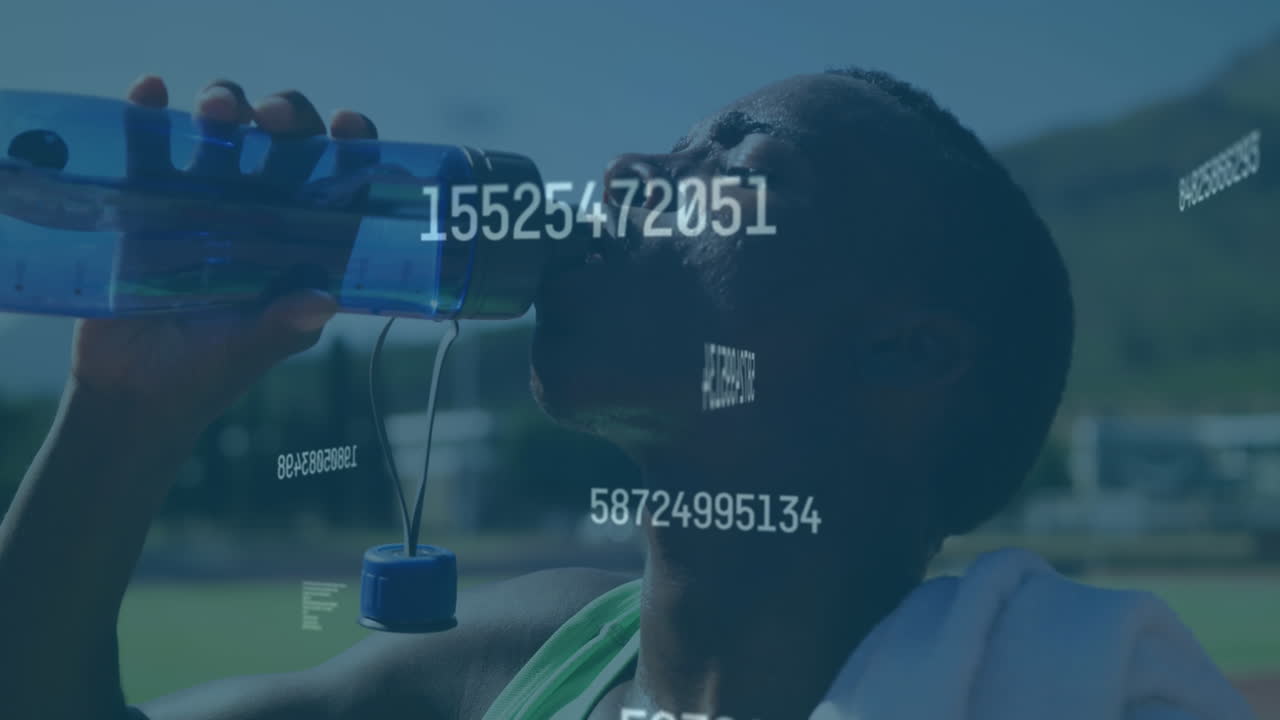 Animation of digital data processing over male athlete drinking water