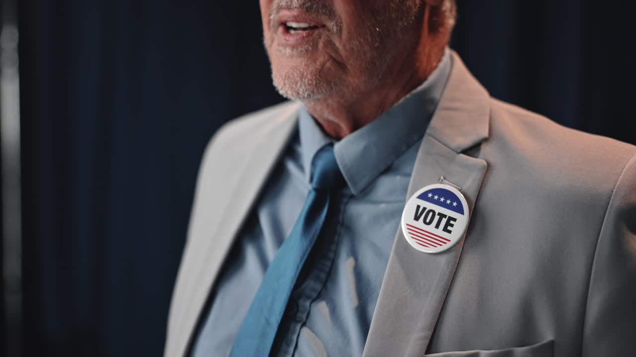 Man wearing a Vote pin