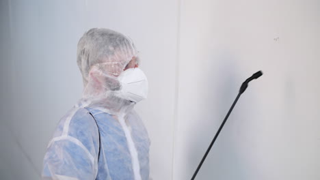 disinfection procedure by a worker in protective gear