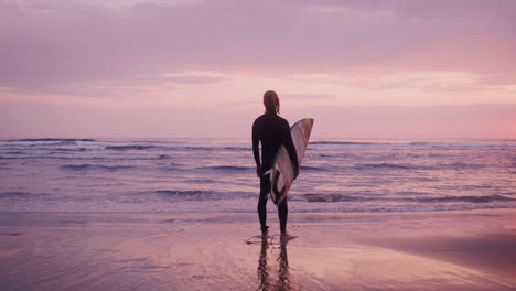 surfer at sunset beach