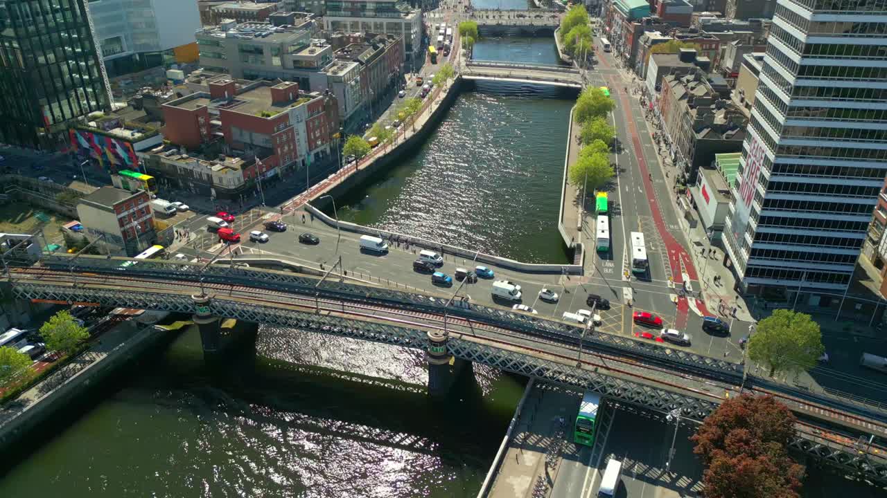 Aerial video of traffic in Dublin City Centre, Ireland on a bright sunny day. The River Liffey can be seen below. Filmed in 4K, 60FPS and in Rec709 Color.