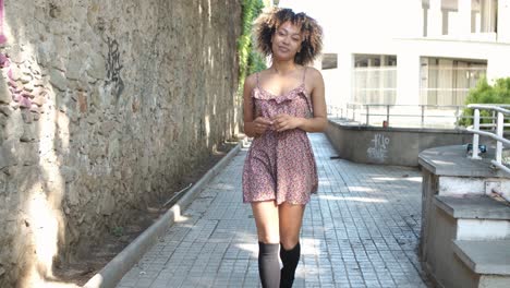 contemporary young woman in dress on street