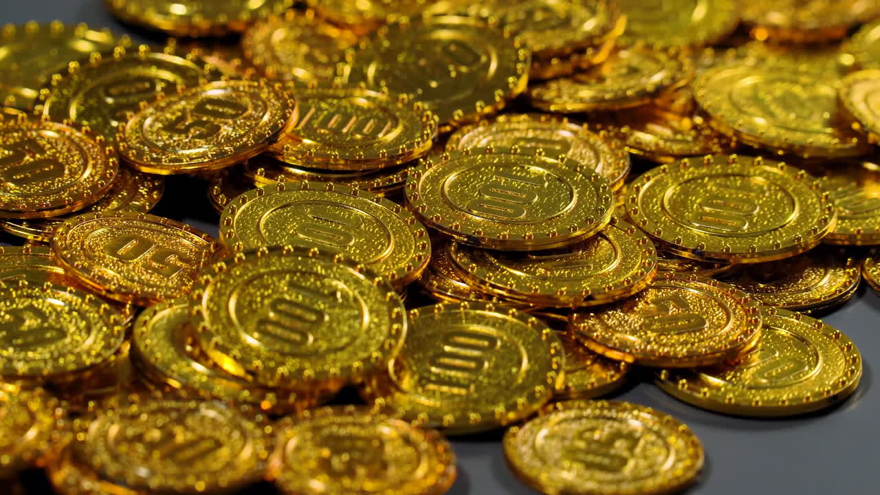 Stacks of Golden coin bills representing wealth, investment, and financial success. Much money, earned capital, wealth in the bank, treasure hoard