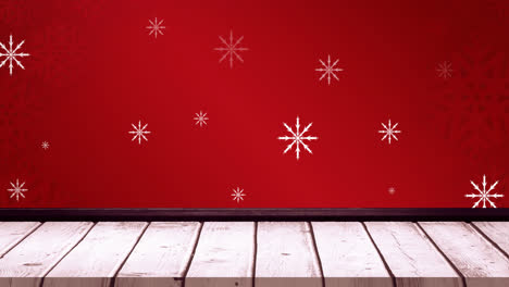 animation of falling snowflakes on red background and wooden floor