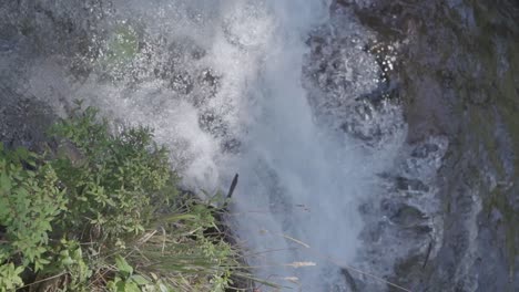 A-slow-motion-close-up-of-a-water-flowing-in-a-river