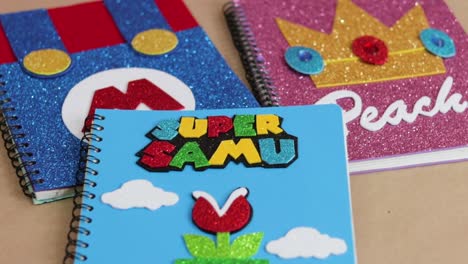 colorful kids notebooks with video game theme covers, hand made notepads