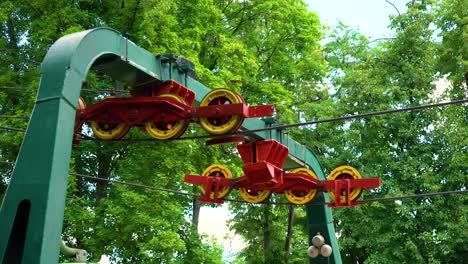 rotating wheels and reinforced metal cables of funicular mechanism in city park