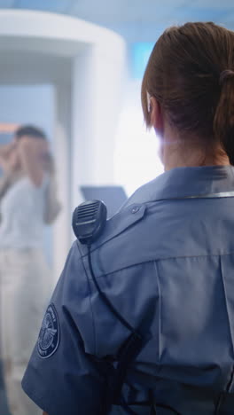 airport security officer performing security check