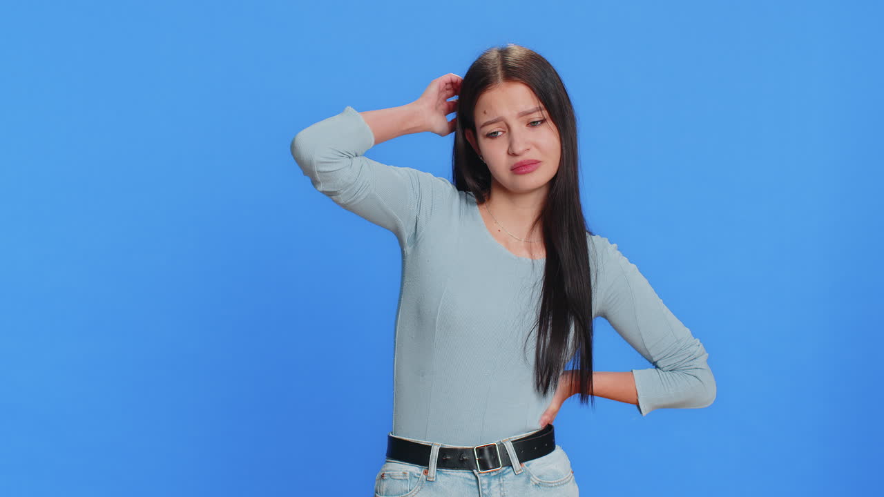 Confused woman girl feeling embarrassed about question having doubts no answer clueless uncertain