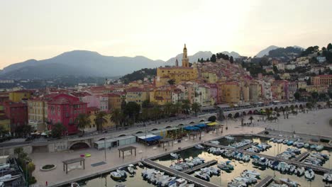 Colorful,-Europe-Buildings-on-France-Beach-Coastline-in-Menton---Aerial-at-Sunset