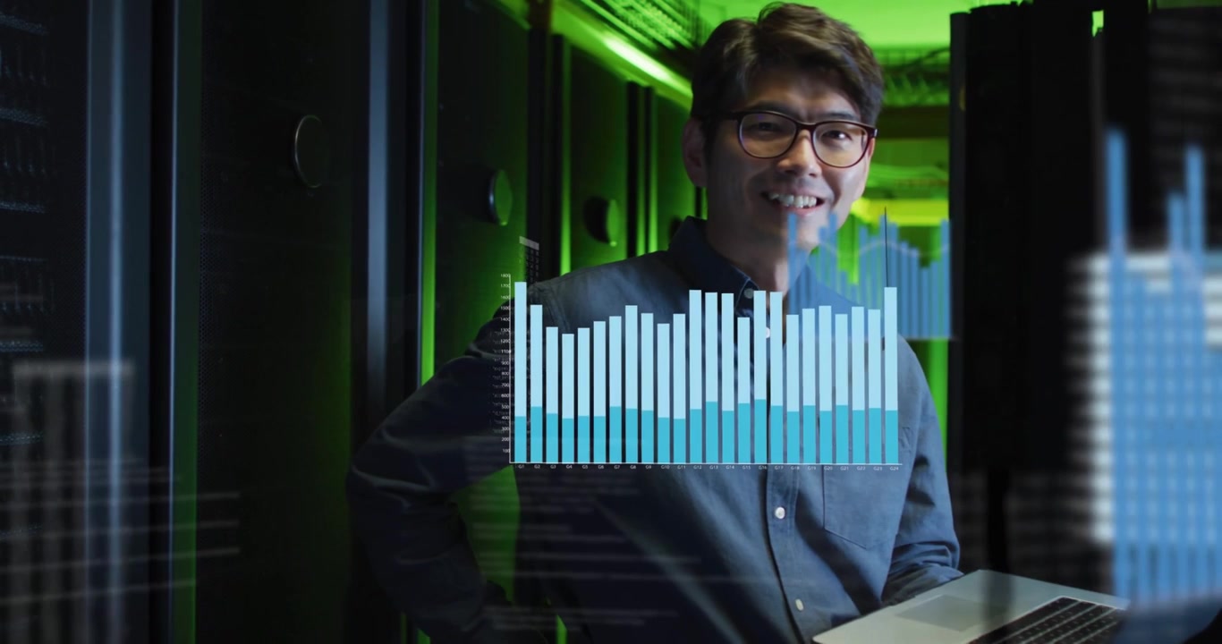 Vertical video: Holding laptop, man viewing charts animating in racks, monitoring in button-down
