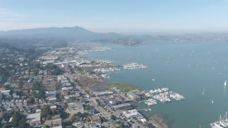 aerial view of a coastal town with boats and marina