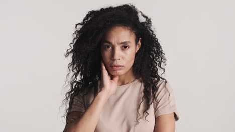 african american upset woman over white background.